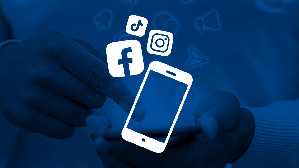 Social media icons over a cell phone representing social media marketing and management